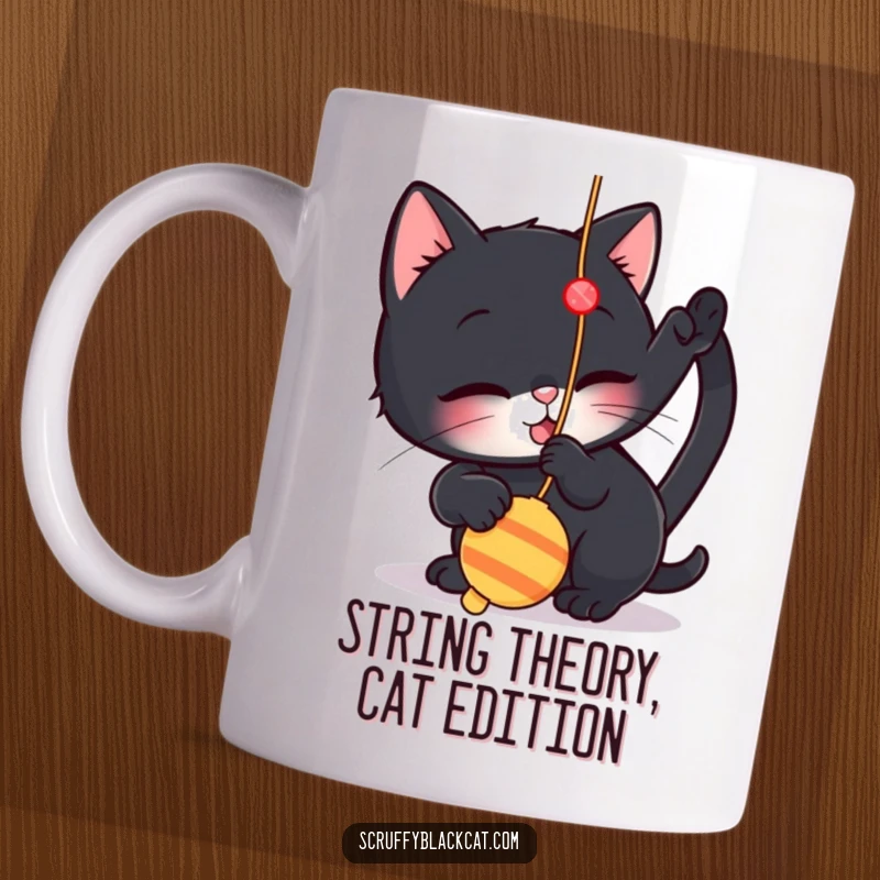 Funny mug featuring a small black cat playfully batting at a dangling string toy, capturing a moment of pure feline amusement.