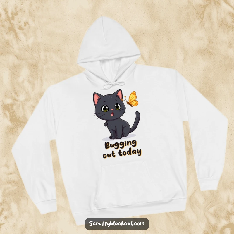 Funny Hoodie: A black cat with a surprised expression chasing a fluttering butterfly, expressing delightful bewilderment and chase.