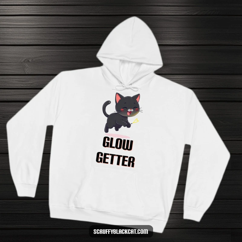 Funny hoodie featuring a playful black cat joyfully chasing a tiny flickering firefly, exuding nighttime adventure and charm.