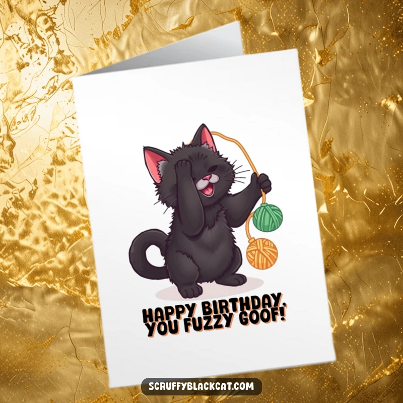 Funny Free Printable Birthday Card: Scruffy black cat playfully batting at a red yarn ball, ready to party.
