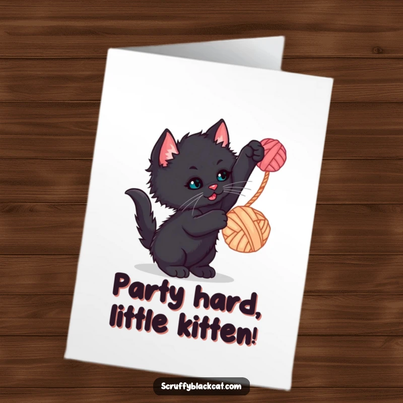 Funny Free Printable Birthday Card: A scruffy black kitten gleefully batting at a colorful ball of yarn dangling playfully.