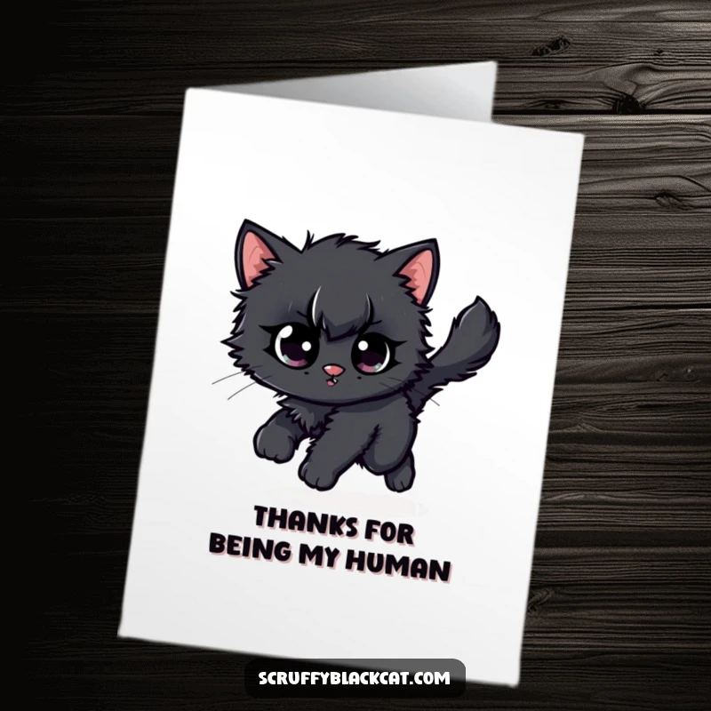 Funny Free Printable thank you card: A scruffy black kitten hypnotically chases its tail, a perfect symbol of boundless gratitude.