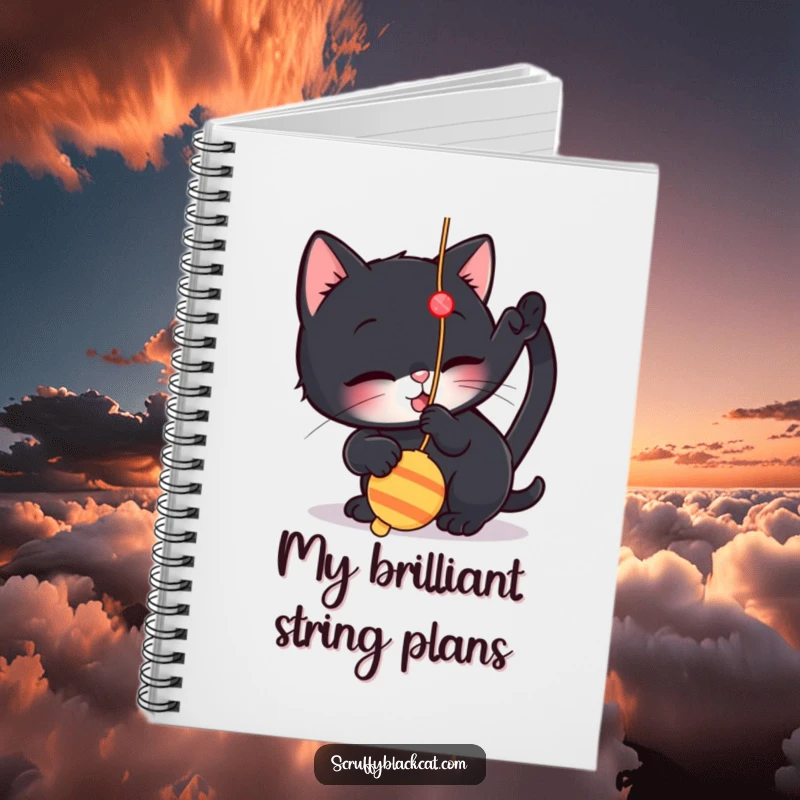 Funny notebook with a cat illustration playfully batting at a dangling string toy, perfect for notes and feline-inspired journaling.