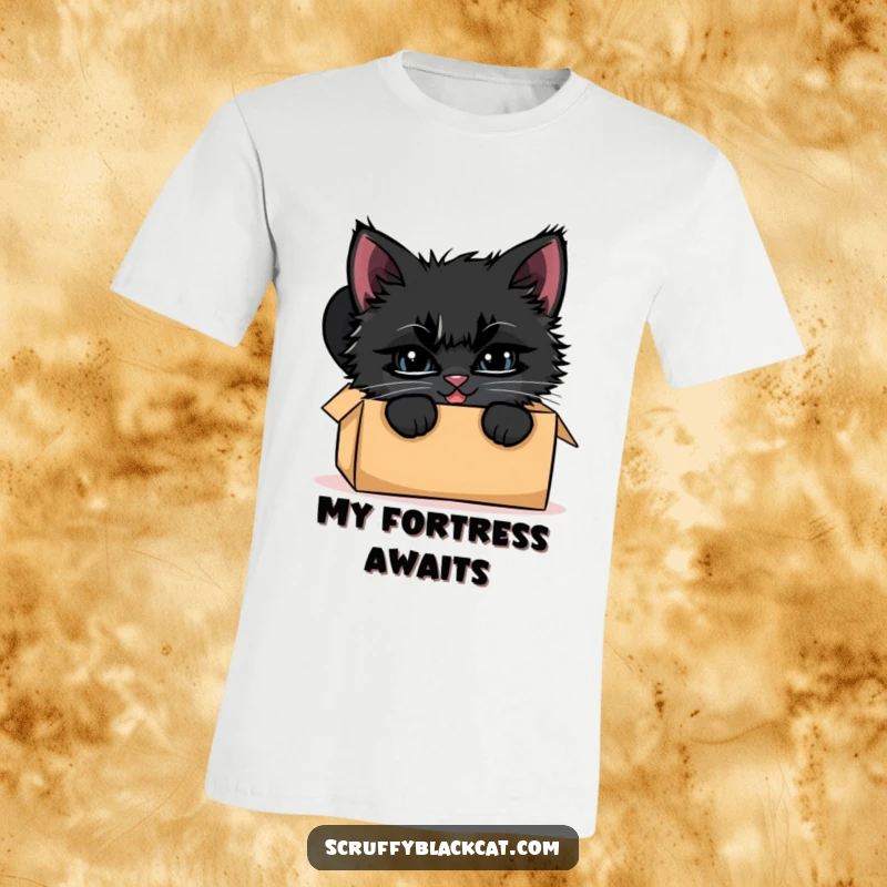 Funny black kitten t-shirt, illustrated peeking out of a cardboard box with a wide, mischievous grin and sparkling eyes.