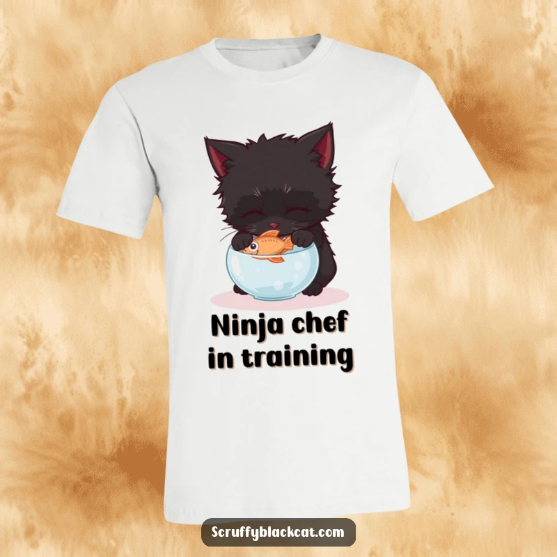 Funny black kitten t-shirt, illustrated gently trying to steal a fish from a tiny bowl with intense, focused eyes.