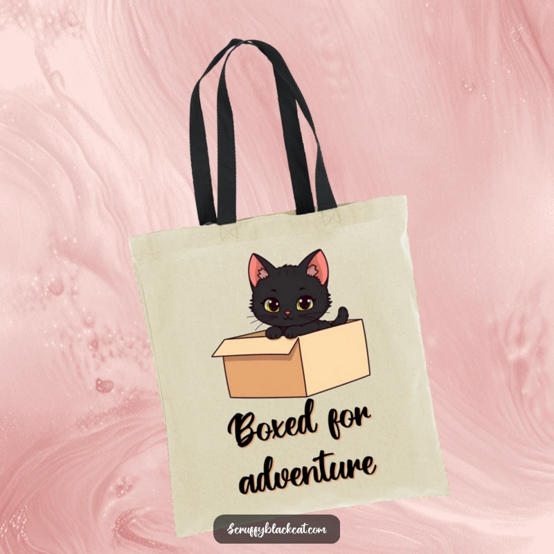 Funny tote bag showcasing a mischievous black kitten peeking from a shadowy box, perfect for carrying daily items.