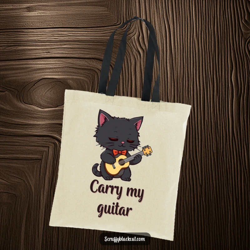 Funny black cat wearing a bow tie, playing a small guitar, showcased on a durable, spacious tote bag.