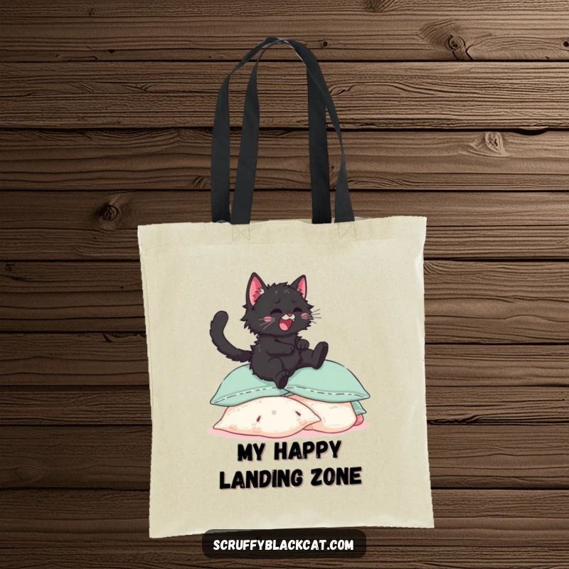 Funny black kitten tote bag, illustrated joyfully leaping onto a heap of soft pillows with eyes sparkling in delight.